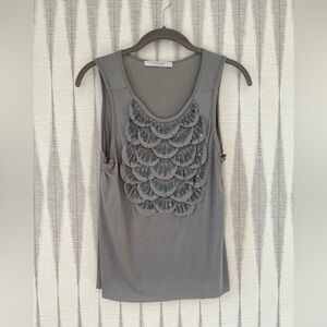 Cotton tank with detailed silver beading. Fits small to medium.